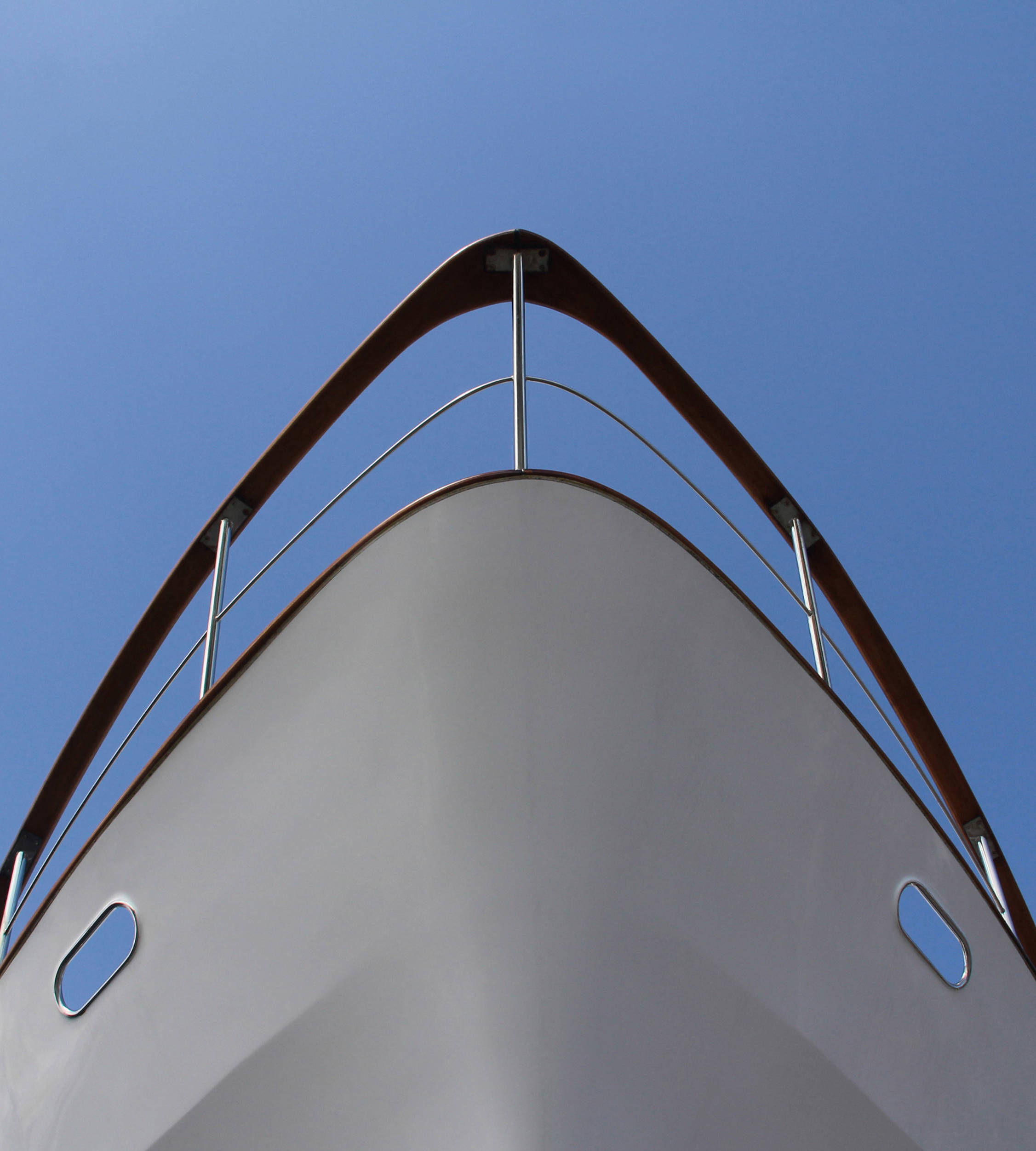 Ships prow seem from below against blue sky