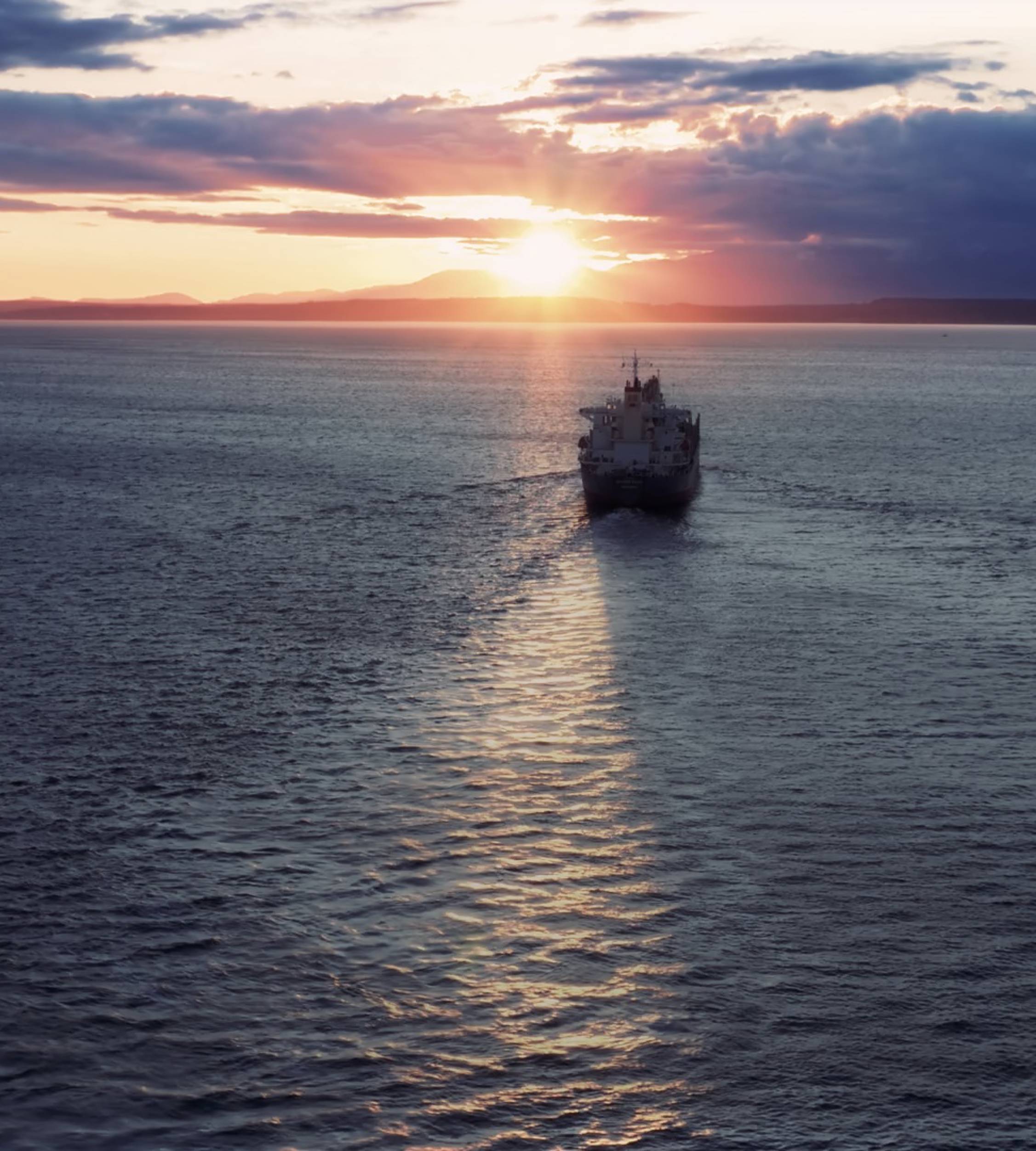 Vessel in the sea with sunset