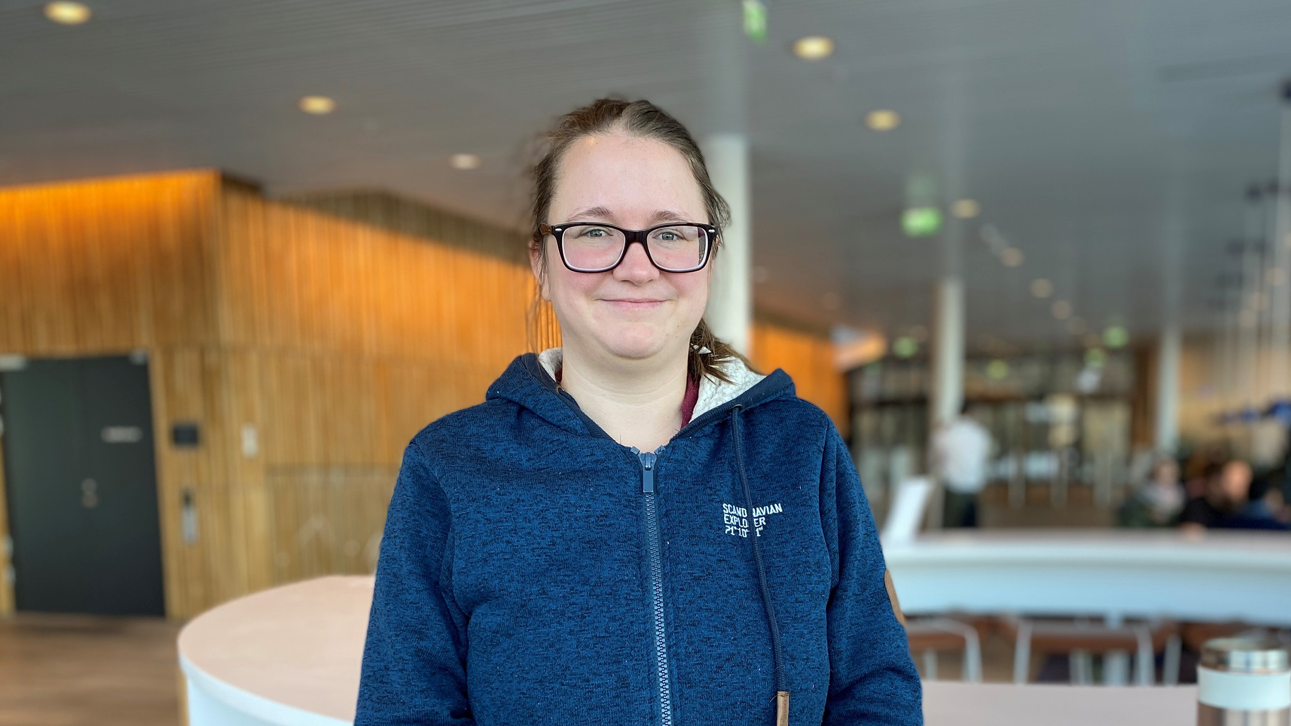 Woman in the café area at Jotun Headquarter in Norway